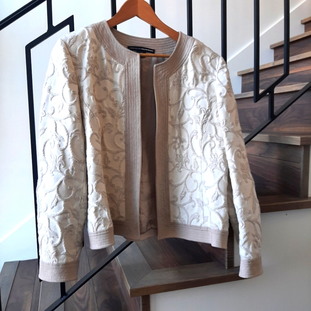 Gorgeous unique jacket with suede like trim and raised motifs.